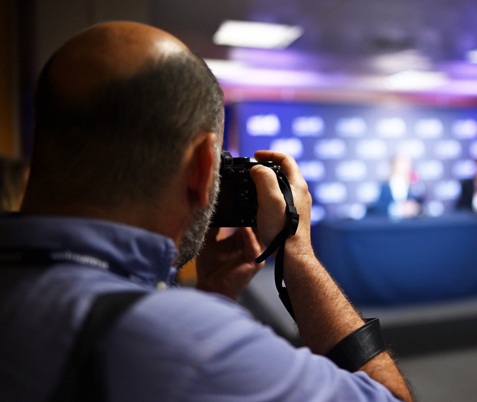Photographer shoots a press conference during day three of Web Summit 2023 at the Altice Arena